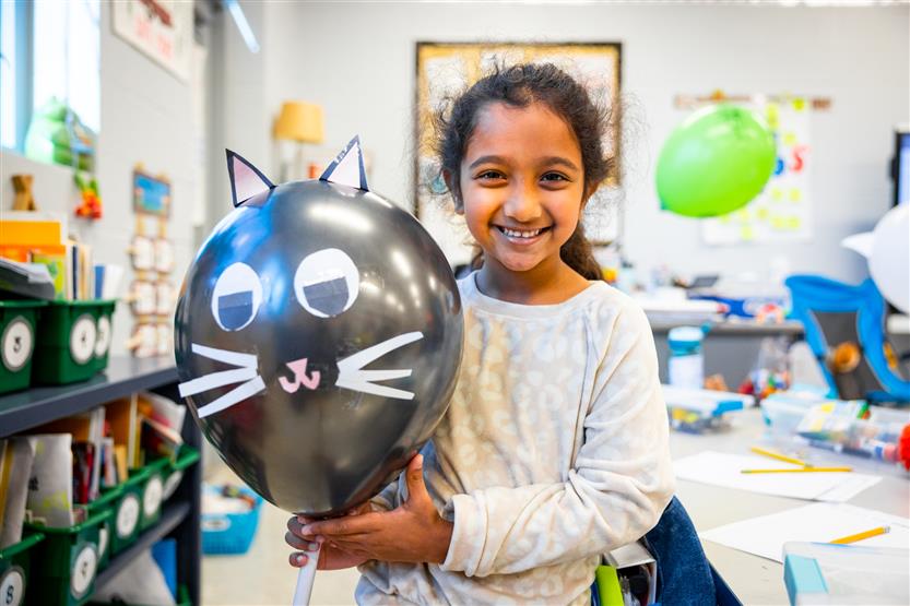 Students participate in a balloon parade